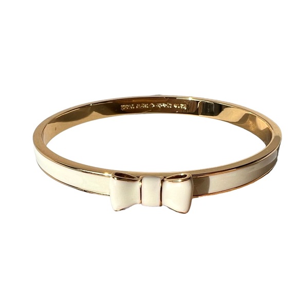 kate spade Jewelry - Kate Spade “Take A Bow” Gold Tone & White Enamel Bangle Bracelet